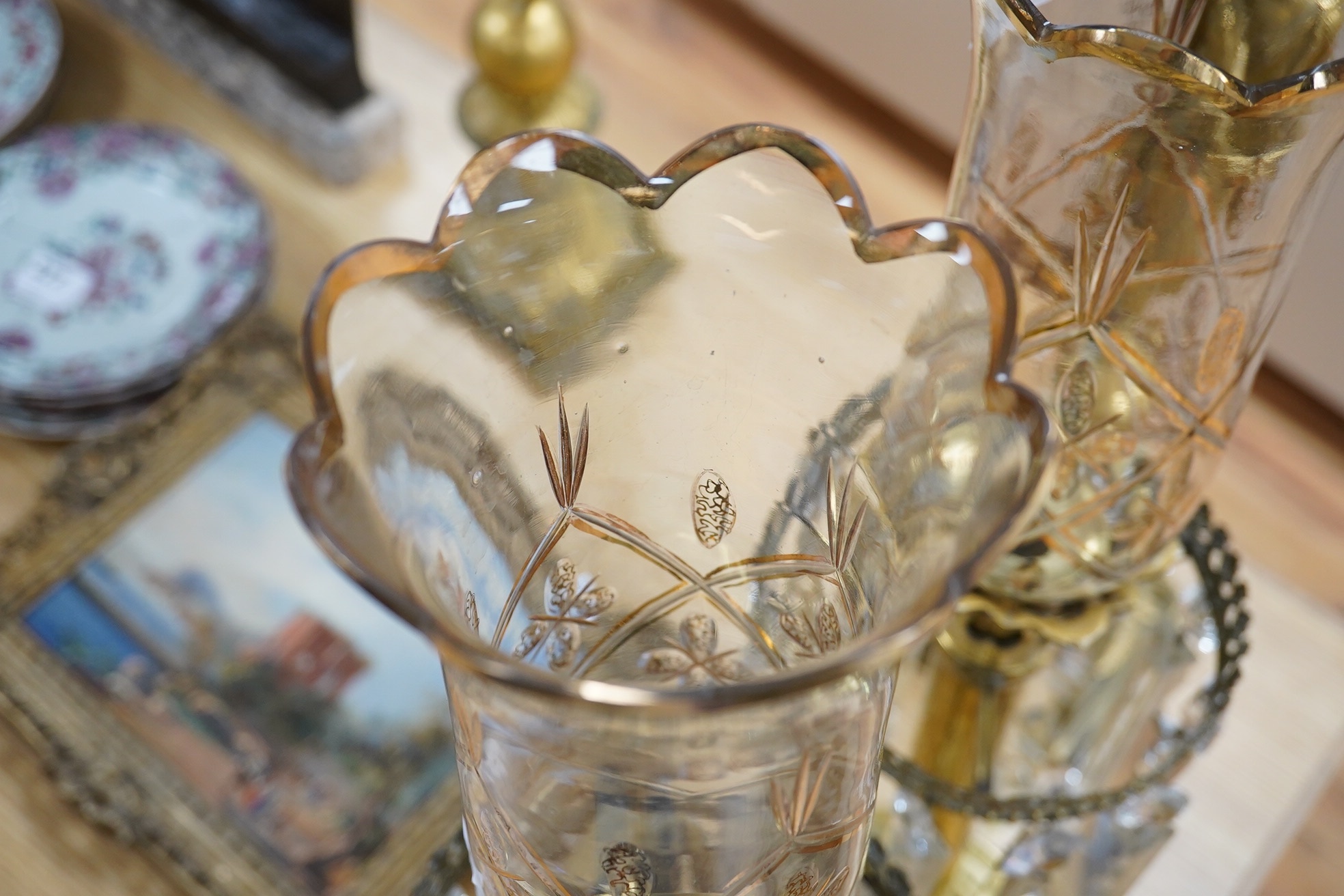 A pair of brass table lustres with storm shades, overall 63cm high, drops 21/26cm long. Condition- good